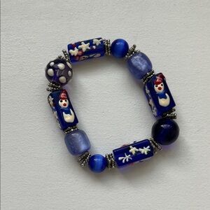 Blue Beaded Bracelet with Snowman Design